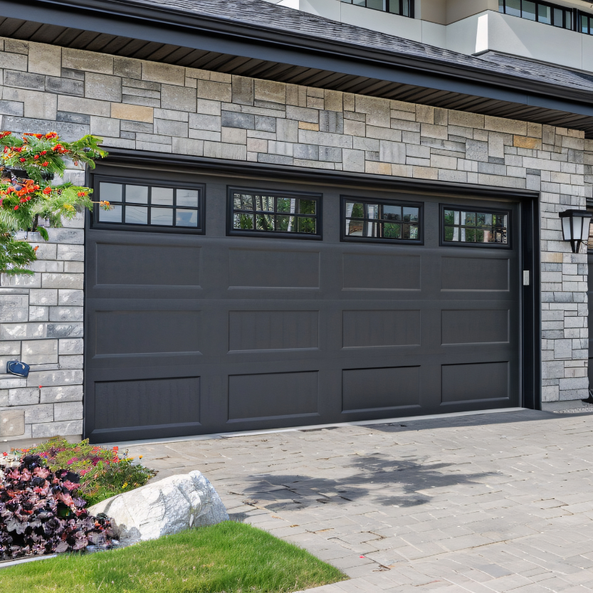Recently replaced premium dark garage door on a modern San Diego home